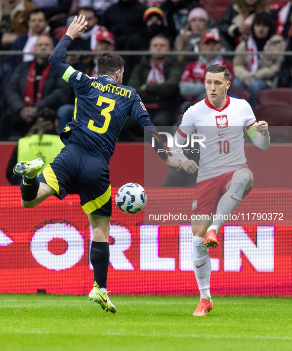 Andy Robertson , Piotr Zielinski  during UEFA Nations League match Poland vs Scotland in Warsaw Poland on 18 November 2024. 