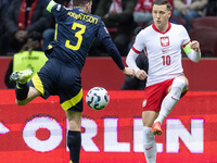 Andy Robertson , Piotr Zielinski  during UEFA Nations League match Poland vs Scotland in Warsaw Poland on 18 November 2024. (