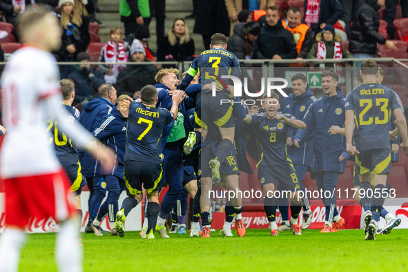 Scottish players celebrate scoring the winning goal during the UEFA Nations League 2024 Group A A1 match between Poland and Scotland at PGE...