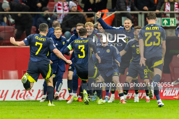 Scottish players celebrate scoring the winning goal during the UEFA Nations League 2024 Group A A1 match between Poland and Scotland at PGE...