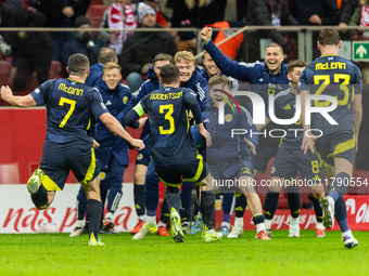 Scottish players celebrate scoring the winning goal during the UEFA Nations League 2024 Group A A1 match between Poland and Scotland at PGE...