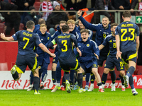 Scottish players celebrate scoring the winning goal during the UEFA Nations League 2024 Group A A1 match between Poland and Scotland at PGE...