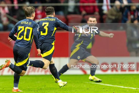 Andy Robertson is celebrating  scoring the winning goal during the UEFA Nations League 2024 Group A A1 match between Poland and Scotland at...