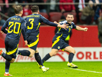 Andy Robertson is celebrating  scoring the winning goal during the UEFA Nations League 2024 Group A A1 match between Poland and Scotland at...