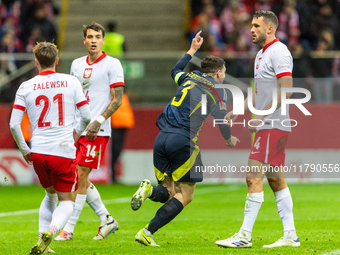 Andy Robertson is celebrating  scoring the winning goal during the UEFA Nations League 2024 Group A A1 match between Poland and Scotland at...