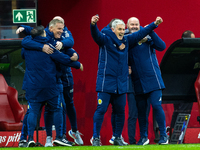 Steve Clarke (R) and coaching staff are celebrating  victory during the UEFA 2024 UEFA Nations League Group A1 football match between Poland...