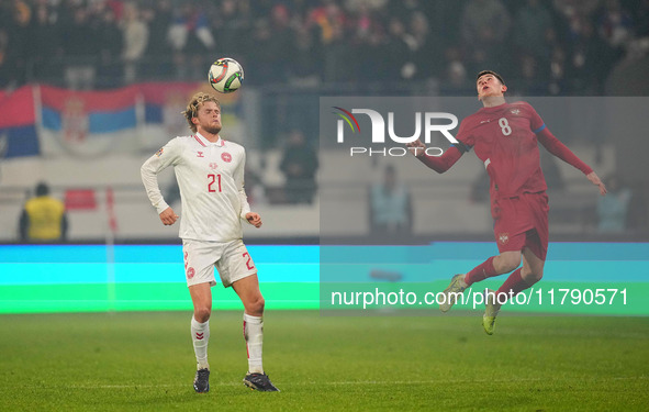 Morten Hjulmand of Denmark and Andrija Maksimovic of Serbia battle for the ball during the Nations League Round 6 match between Serbia qnd D...