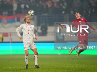 Morten Hjulmand of Denmark and Andrija Maksimovic of Serbia battle for the ball during the Nations League Round 6 match between Serbia qnd D...