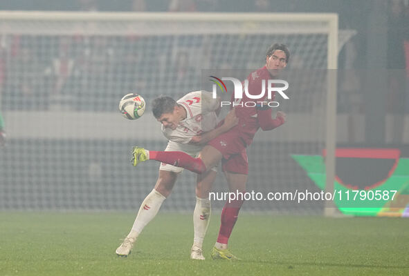 Jannik Vestergaard of Denmark and Dusan Vlahovic of Serbia battle for the ball during the Nations League Round 6 match between Serbia qnd De...