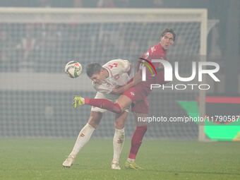 Jannik Vestergaard of Denmark and Dusan Vlahovic of Serbia battle for the ball during the Nations League Round 6 match between Serbia qnd De...