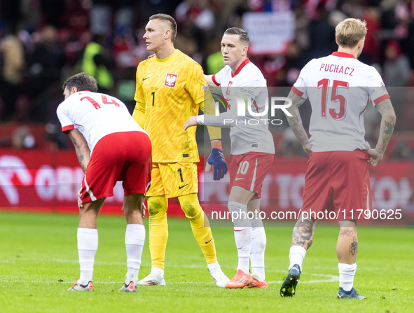 Jakub Kiwior , Lukasz Skorupski , Piotr Zielinski , Tymoteusz Puchacz  during UEFA Nations League match Poland vs Scotland in Warsaw Poland...