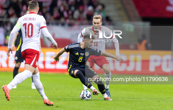 Piotr Zielinski , Billy Gilmour , Adam Buksa  during UEFA Nations League match Poland vs Scotland in Warsaw Poland on 18 November 2024. 