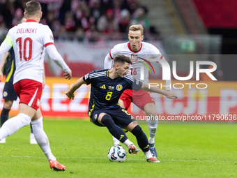 Piotr Zielinski , Billy Gilmour , Adam Buksa  during UEFA Nations League match Poland vs Scotland in Warsaw Poland on 18 November 2024. (