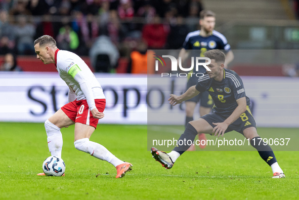 Piotr Zielinski , Billy Gilmour  during UEFA Nations League match Poland vs Scotland in Warsaw Poland on 18 November 2024. 