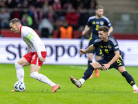 Piotr Zielinski , Billy Gilmour  during UEFA Nations League match Poland vs Scotland in Warsaw Poland on 18 November 2024. (