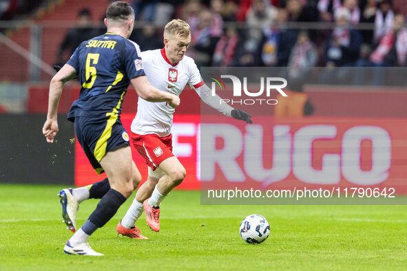 Grant Hanley , Karol Swiderski  during UEFA Nations League match Poland vs Scotland in Warsaw Poland on 18 November 2024. 