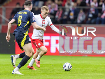 Grant Hanley , Karol Swiderski  during UEFA Nations League match Poland vs Scotland in Warsaw Poland on 18 November 2024. (