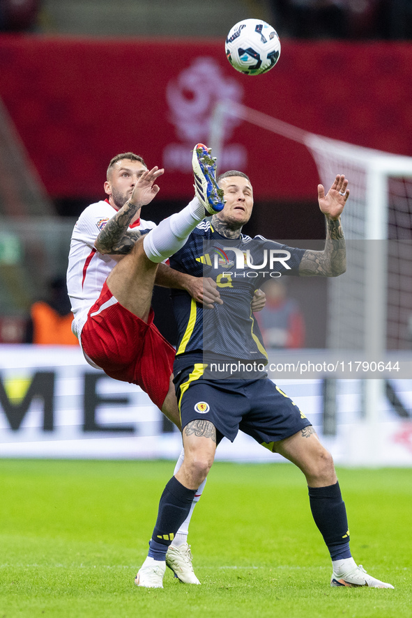 Sebastian Walukiewicz , Lyndon Dykes  during UEFA Nations League match Poland vs Scotland in Warsaw Poland on 18 November 2024. 