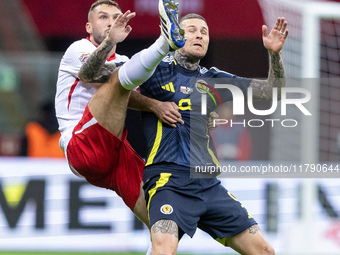 Sebastian Walukiewicz , Lyndon Dykes  during UEFA Nations League match Poland vs Scotland in Warsaw Poland on 18 November 2024. (