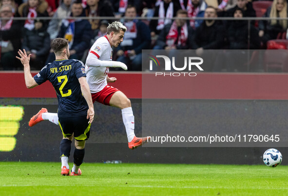 Anthony Ralston , Jakub Kaminski  during UEFA Nations League match Poland vs Scotland in Warsaw Poland on 18 November 2024. 