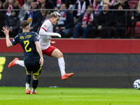 Anthony Ralston , Jakub Kaminski  during UEFA Nations League match Poland vs Scotland in Warsaw Poland on 18 November 2024. (