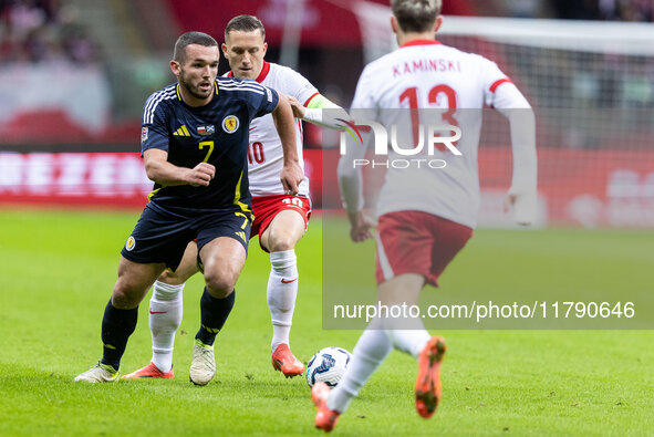 John McGinn , Piotr Zielinski , Jakub Kaminski  during UEFA Nations League match Poland vs Scotland in Warsaw Poland on 18 November 2024. 