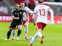 John McGinn , Piotr Zielinski , Jakub Kaminski  during UEFA Nations League match Poland vs Scotland in Warsaw Poland on 18 November 2024. (