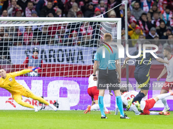 Lukasz Skorupski , John McGinn , goal during UEFA Nations League match Poland vs Scotland in Warsaw Poland on 18 November 2024. (