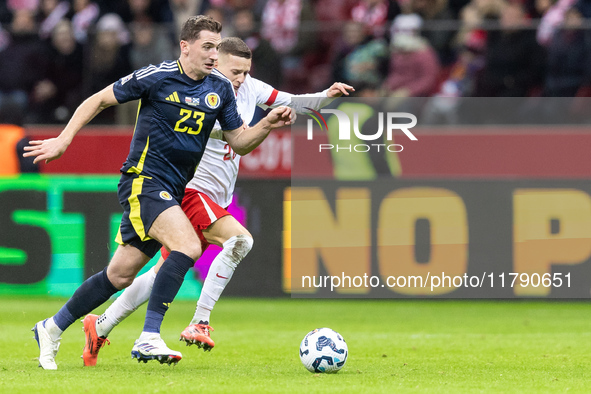 Kenny McLean , Sebastian Szymanski  during UEFA Nations League match Poland vs Scotland in Warsaw Poland on 18 November 2024. 