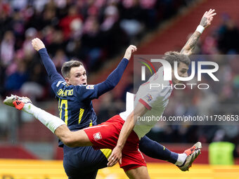 Lawrence Shankland , Jakub Kiwior  during UEFA Nations League match Poland vs Scotland in Warsaw Poland on 18 November 2024. (