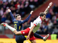 Lawrence Shankland , Jakub Kiwior  during UEFA Nations League match Poland vs Scotland in Warsaw Poland on 18 November 2024. (