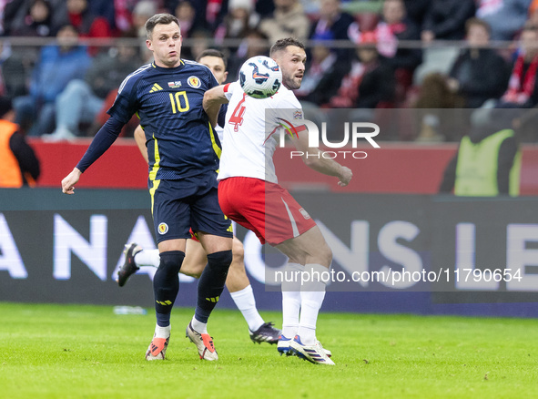 Lawrence Shankland , Sebastian Walukiewicz  during UEFA Nations League match Poland vs Scotland in Warsaw Poland on 18 November 2024. 