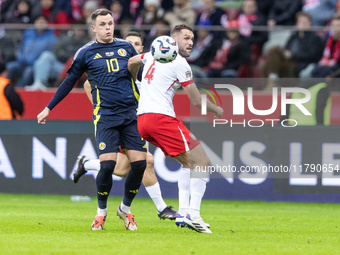 Lawrence Shankland , Sebastian Walukiewicz  during UEFA Nations League match Poland vs Scotland in Warsaw Poland on 18 November 2024. (