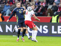 Lawrence Shankland , Sebastian Walukiewicz  during UEFA Nations League match Poland vs Scotland in Warsaw Poland on 18 November 2024. (