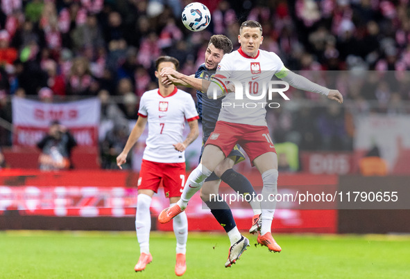 Billy Gilmour , Piotr Zielinski  during UEFA Nations League match Poland vs Scotland in Warsaw Poland on 18 November 2024. 