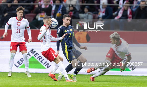 Sebastian Szymanski , Andy Robertson , Kamil Piatkowski  during UEFA Nations League match Poland vs Scotland in Warsaw Poland on 18 November...