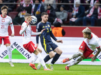 Sebastian Szymanski , Andy Robertson , Kamil Piatkowski  during UEFA Nations League match Poland vs Scotland in Warsaw Poland on 18 November...