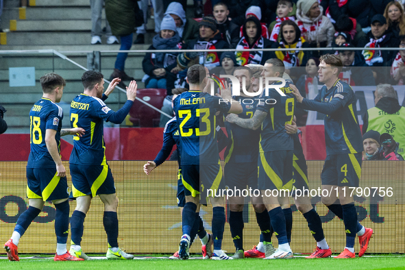 Scottish players celebrate scoring a goal during the  UEFA Nations League 2024 League A Group A1 match between Poland and Scotland, at the...