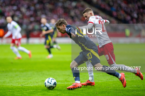 Ryan Gauld (L) and Sebastian Szymanski during the  UEFA Nations League 2024 League A Group A1 match between Poland and Scotland, at the  PGE...