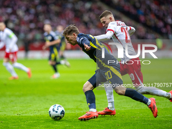 Ryan Gauld (L) and Sebastian Szymanski during the  UEFA Nations League 2024 League A Group A1 match between Poland and Scotland, at the  PGE...