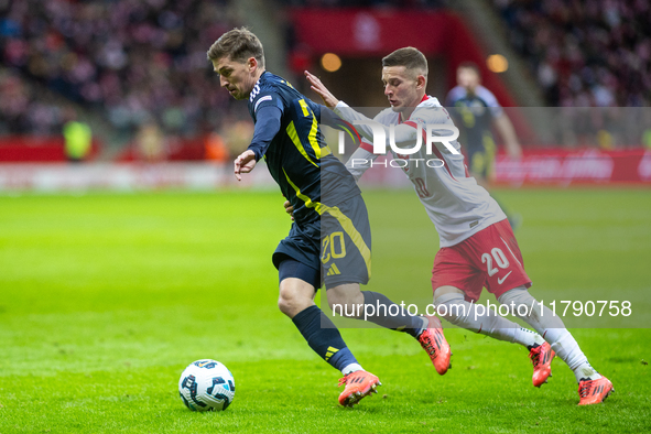 Ryan Gauld (L) and Sebastian Szymanski during the  UEFA Nations League 2024 League A Group A1 match between Poland and Scotland, at the  PGE...