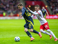 Ryan Gauld (L) and Sebastian Szymanski during the  UEFA Nations League 2024 League A Group A1 match between Poland and Scotland, at the  PGE...