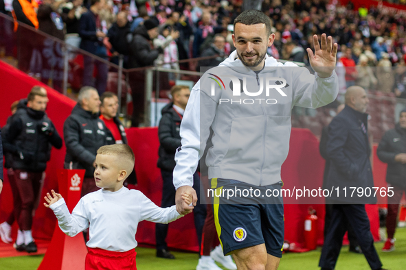 John McGinn walks onto the pitch during the UEFA Nations League 2024 A1 Group A match between Poland and Scotland at PGE Narodowe in Warsaw,...