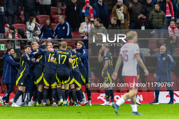 Scottish team celebrates scoring a winning goal  during the  UEFA Nations League 2024 League A Group A1 match between Poland and Scotland, a...