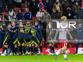 Scottish team celebrates scoring a winning goal  during the  UEFA Nations League 2024 League A Group A1 match between Poland and Scotland, a...