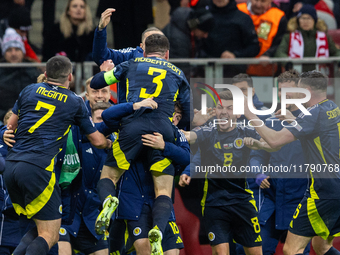 Scottish team celebrates scoring a winning goal  during the  UEFA Nations League 2024 League A Group A1 match between Poland and Scotland, a...