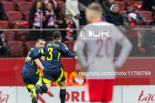 Andy Robertson (C) , and John McGinn (L) celebrate scoring a winning goal  during the  UEFA Nations League 2024 League A Group A1 match betw...