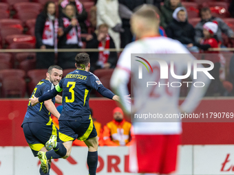 Andy Robertson (C) , and John McGinn (L) celebrate scoring a winning goal  during the  UEFA Nations League 2024 League A Group A1 match betw...