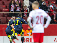 Andy Robertson (C) , and John McGinn (L) celebrate scoring a winning goal  during the  UEFA Nations League 2024 League A Group A1 match betw...