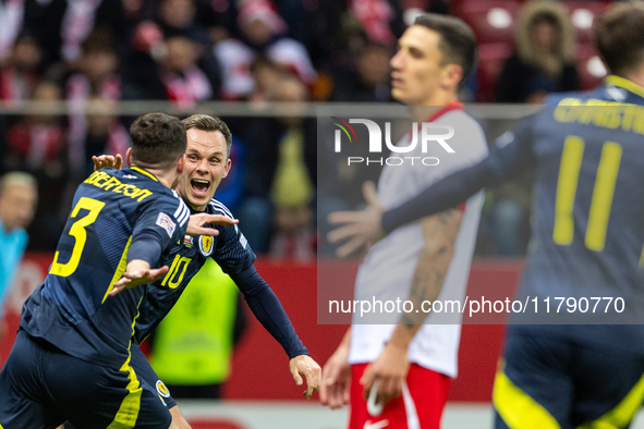 Andy Robertson (L) and Lawrence Shankland celebrate scoring a winning goal during the  UEFA Nations League 2024 League A Group A1 match betw...